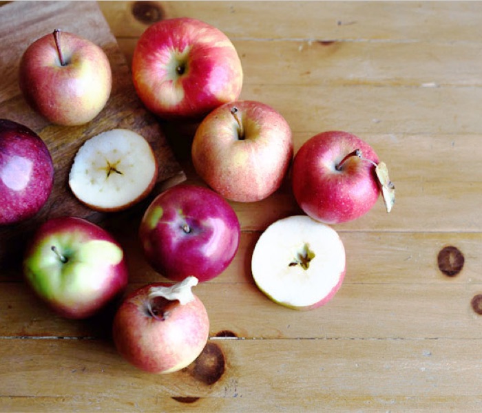 A bunch of apples on a table